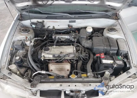 1997 Mitsubishi Mirage De z USA, uszkodzony, nr VIN JA3AY26A0VU044393